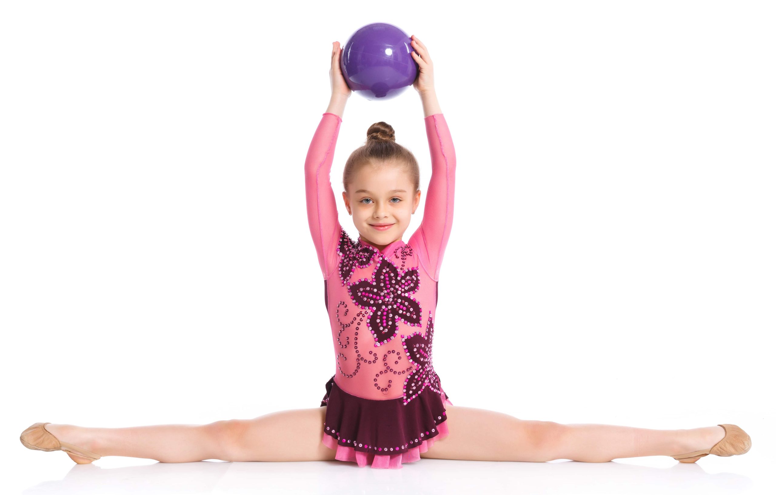 gymnast splits with ball - Toronto Aspirals | Gymnastics Club gymnast with ball doing splits